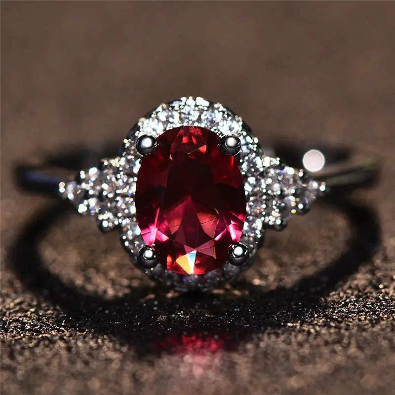 Anello in Argento con Rubino e Cornice Halo