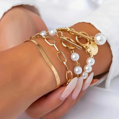 Set di bracciali chic in oro (4 pezzi) – serpente, perle e maglie