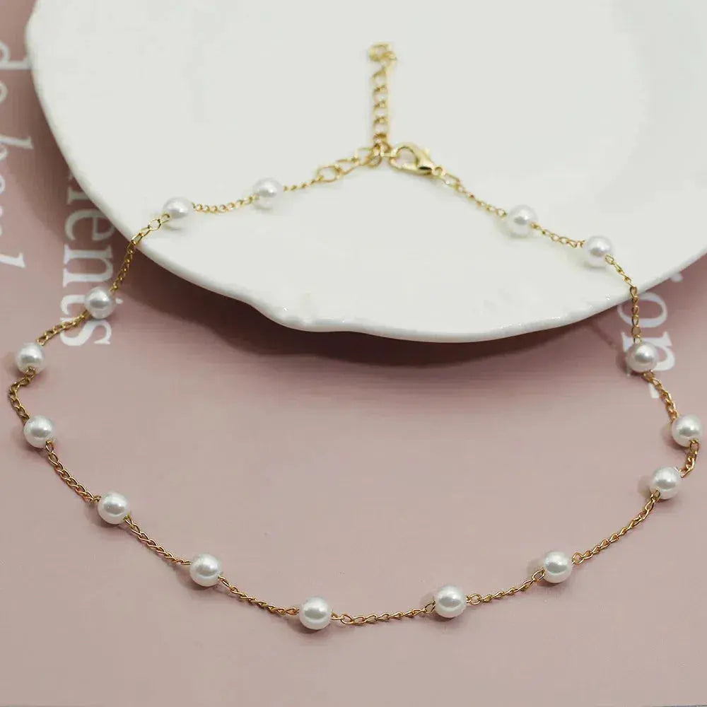 Collana Dorata con Perle Distanziate