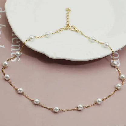 Collana Dorata con Perle Distanziate